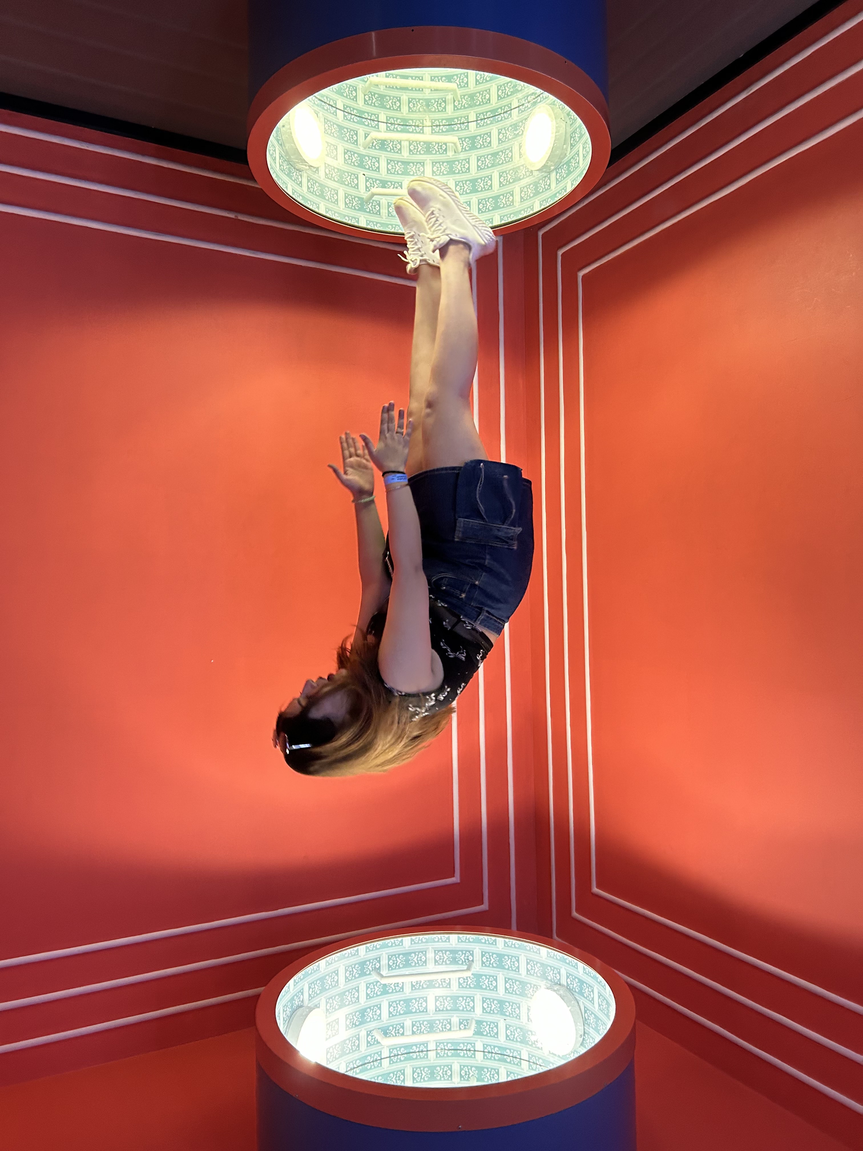 Upside down in a red mirrored room